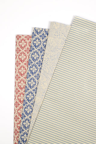 Carta regalo ecologica carta erba rosso blu e righe crema