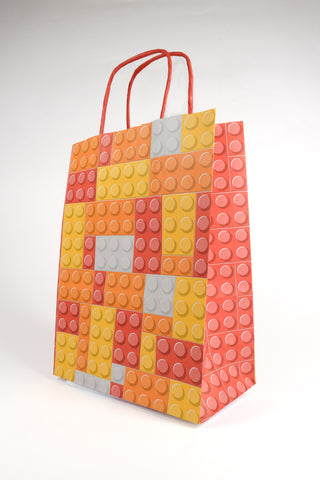 sacchetto mattoncini lego arancione, rosso e giallo profilo 45 gradi